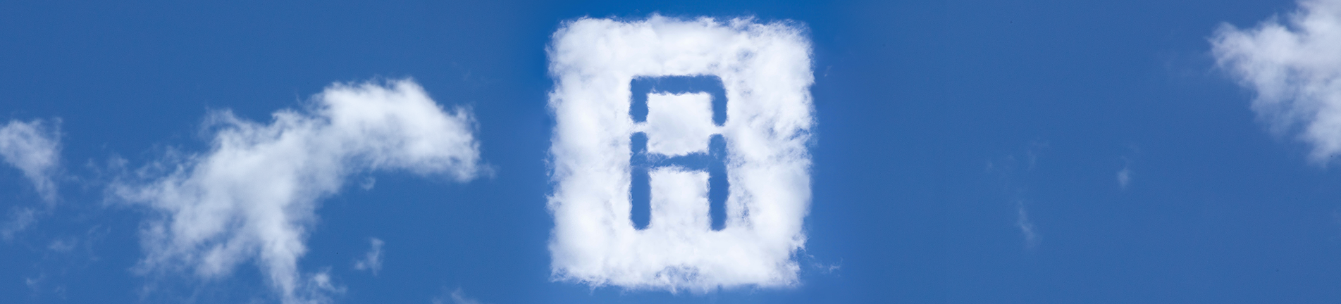 El logotip del Teatre de l'Aurora, la lletra A, en forma de núvol al mig d'un cel blau